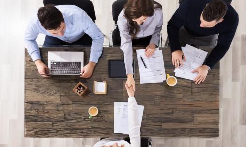 applicants sitting at desk with recruiter