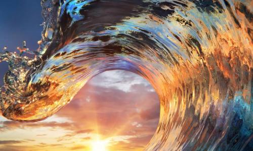 colorful ocean wave at sunset