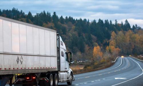 long-haul semi-truck going down the highway