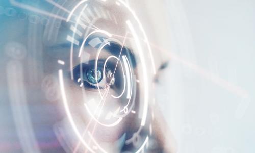 woman with blue eye staring through a digital lens