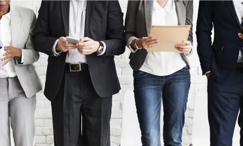 candidates in a line with devices