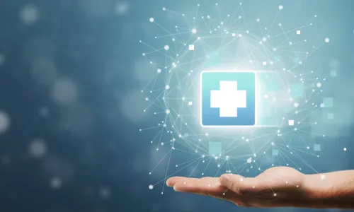 hand holds medical cross symbol