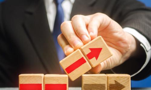 businessman using blocks with arrows