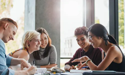 happy young students studying books
