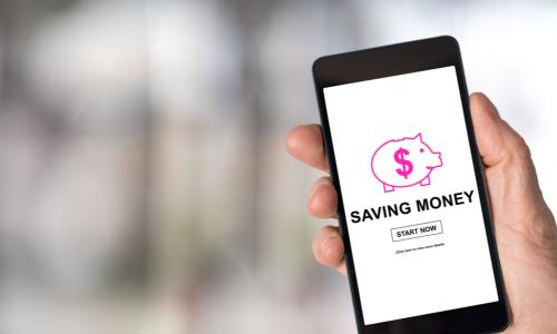 smartphone showing a savings app with a piggy bank
