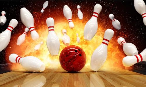bowling ball makes impact with pins for a strike