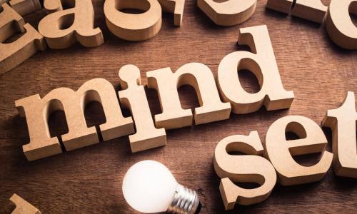 mindset word wood letters with lightbulb