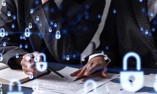 businesswomen working on documents at table with padlocks overtop