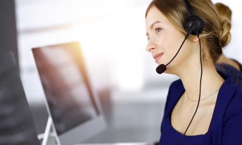 call center worker with headset and computer