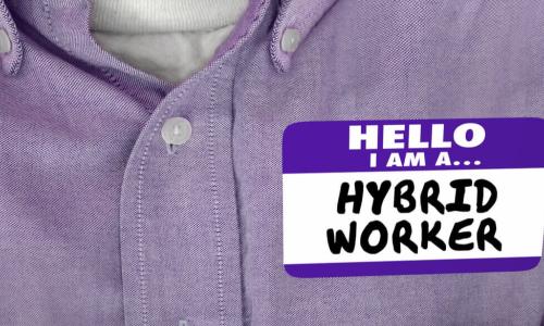 employee in purple shirt with hybrid worker name badge