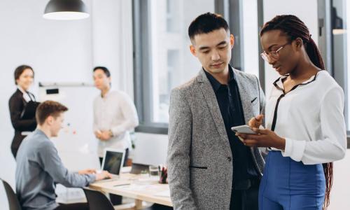 Manager discussing assignment with high-performing employee team member