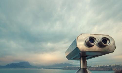 coin operated binocular viewer near a waterway