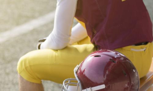 player with helmet on bench