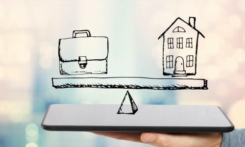 hand holding out tablet below drawing of work briefcase and home on a precarious balance