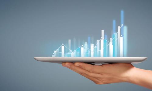 hand holds out tablet iPad projecting data bar graphs