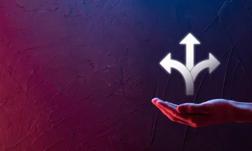 businessman in suit holds three arrows in hand