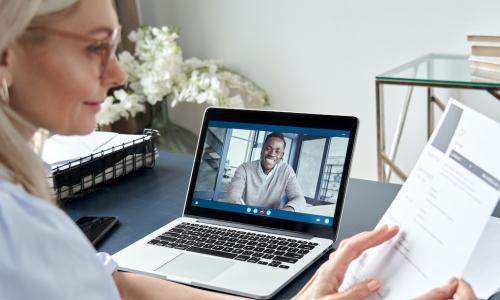 HR manager interviewing job candidate by video conference