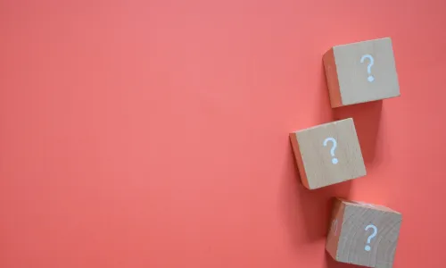 question mark blocks on salmon background