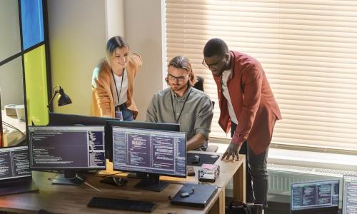 team monitors colorful window