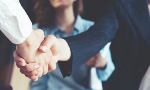 business people shaking hands to seal deal after successful negotiation