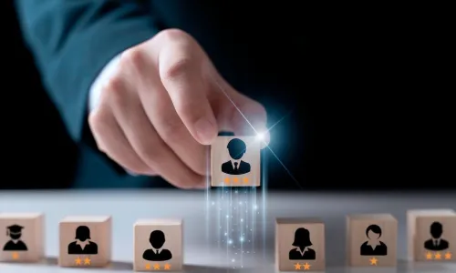 talent development manager selecting high performing employee block