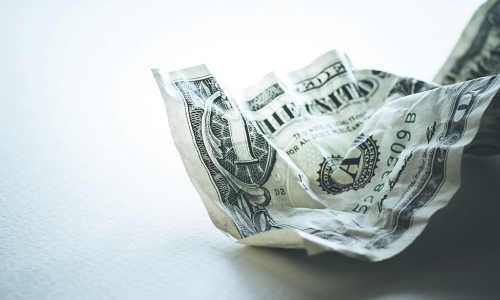 crumpled dollar bill