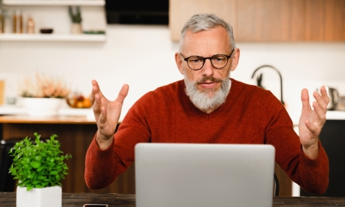 man laptop surprise kitchen