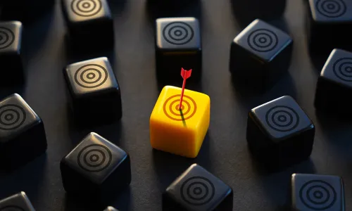 yellow target block with arrow dead center surrounded by black target blocks 