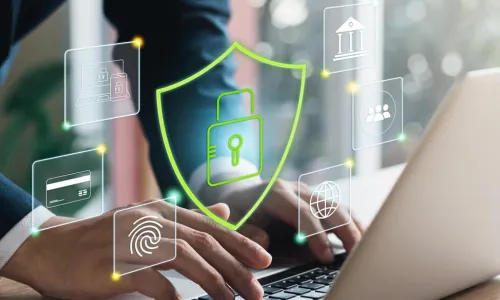 hands typing on laptop