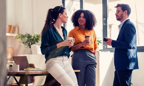3 individuals standing around talking