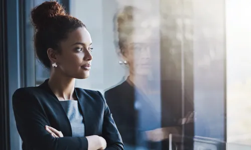 woman looking through window